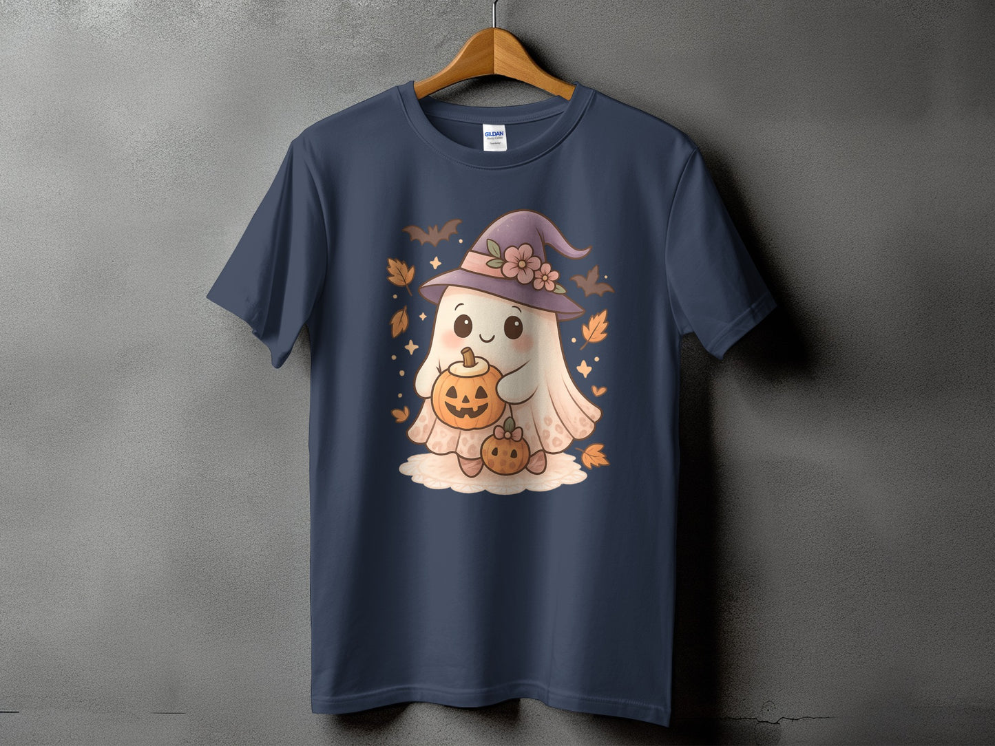 Dark navy t-shirt with a cute cartoon ghost holding pumpkins and wearing a witch hat.