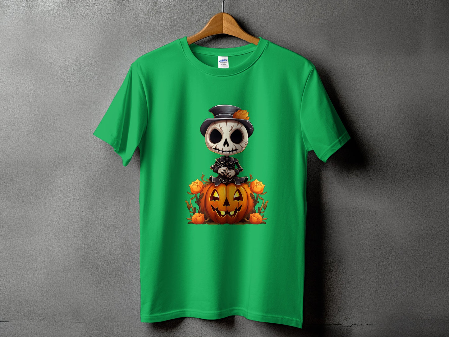 Green t-shirt with cartoon skeleton sitting on a pumpkin.