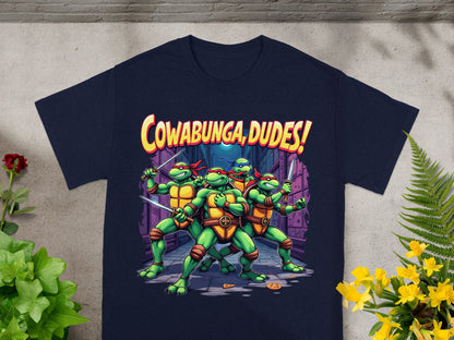 Teenage Mutant Ninja Turtles with "Cowabunga, Dudes!" text on a dark blue t-shirt.
