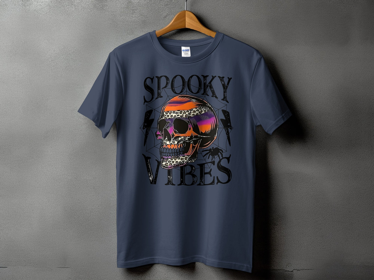 Blue t-shirt with "SPOOKY VIBES" text and a colorful skull graphic.