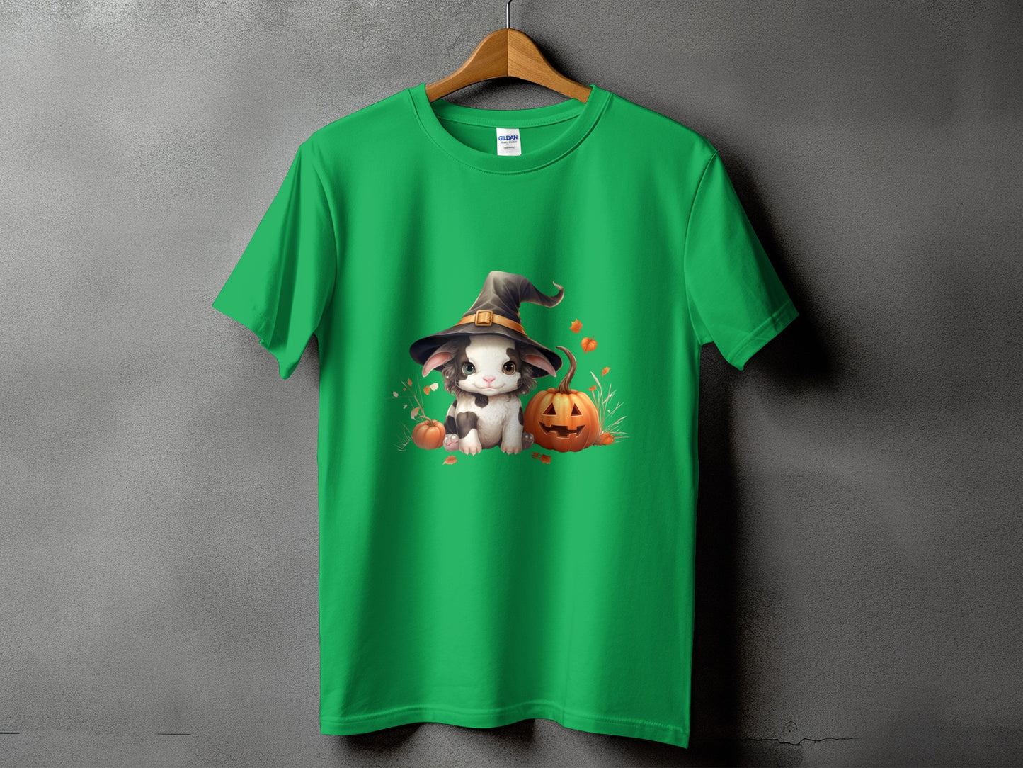 Green t-shirt with a whimsical Halloween graphic of a bunny wearing a witch hat and pumpkins.
