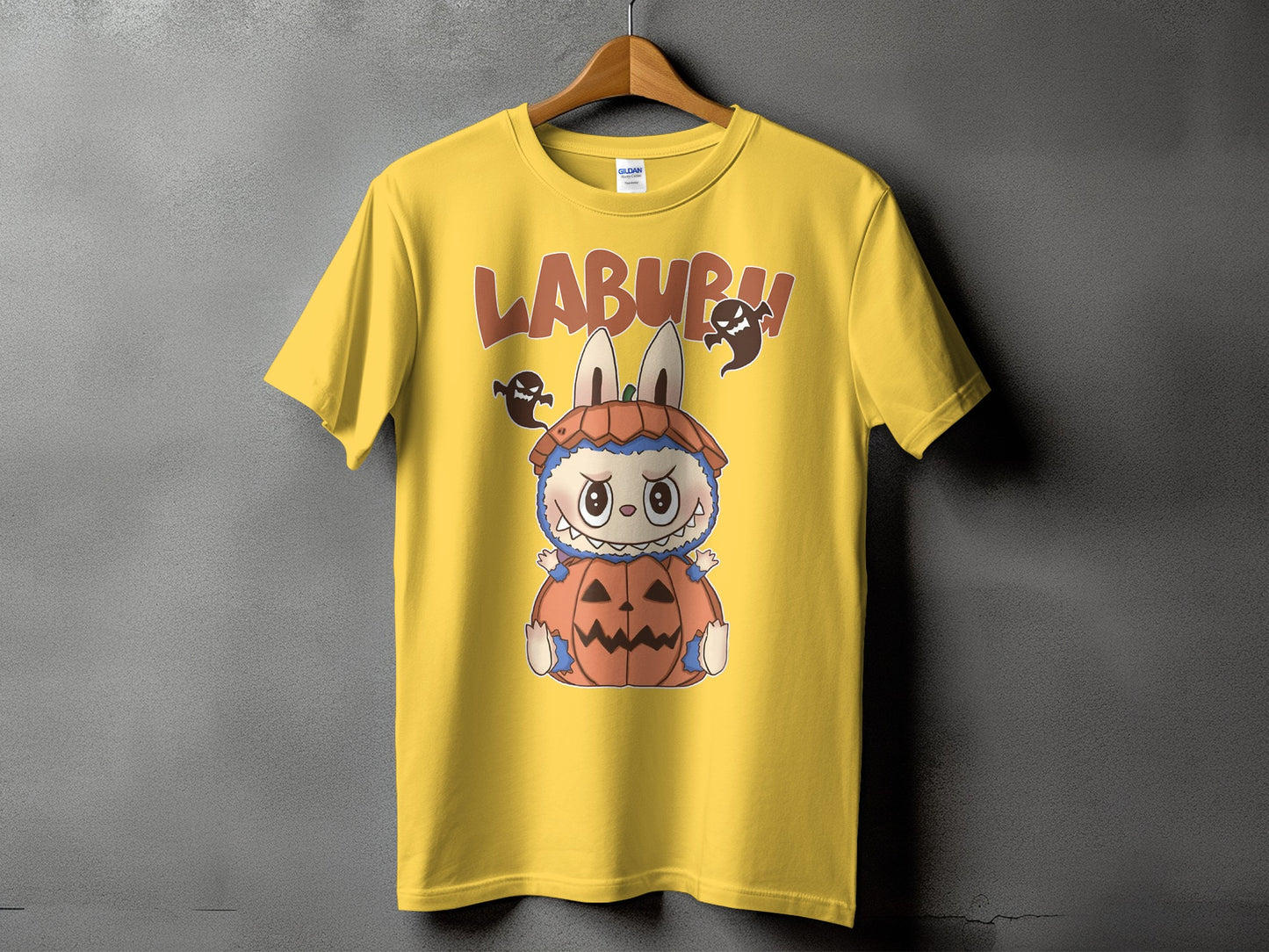 Yellow t-shirt with "LABURH" text, a cartoon bunny-like creature in a pumpkin, and ghosts.