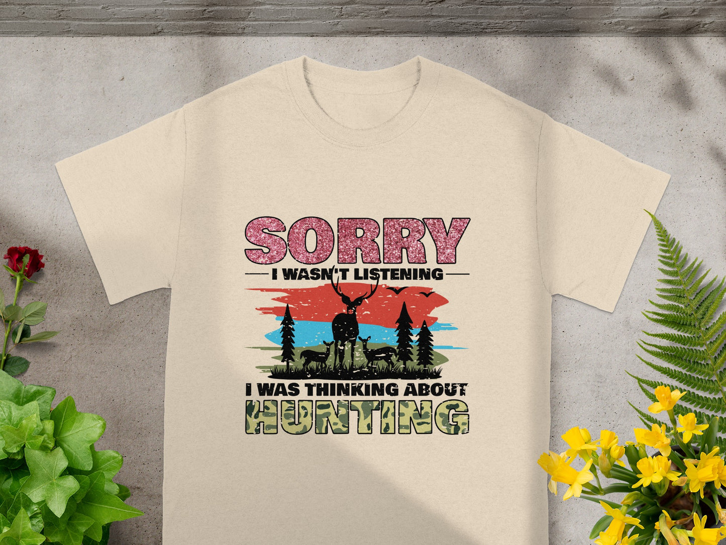 T-shirt with "Sorry I wasn't listening, I was thinking about hunting" and deer graphic.