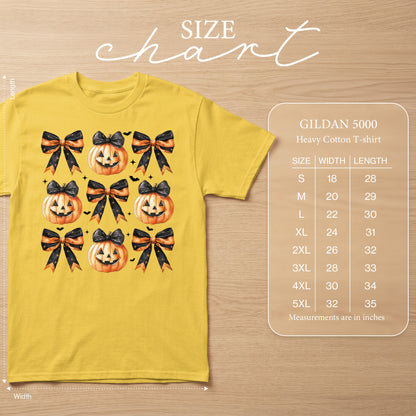 Yellow Gildan 5000 t-shirt with a repeating pattern of jack-o'-lanterns and bows.