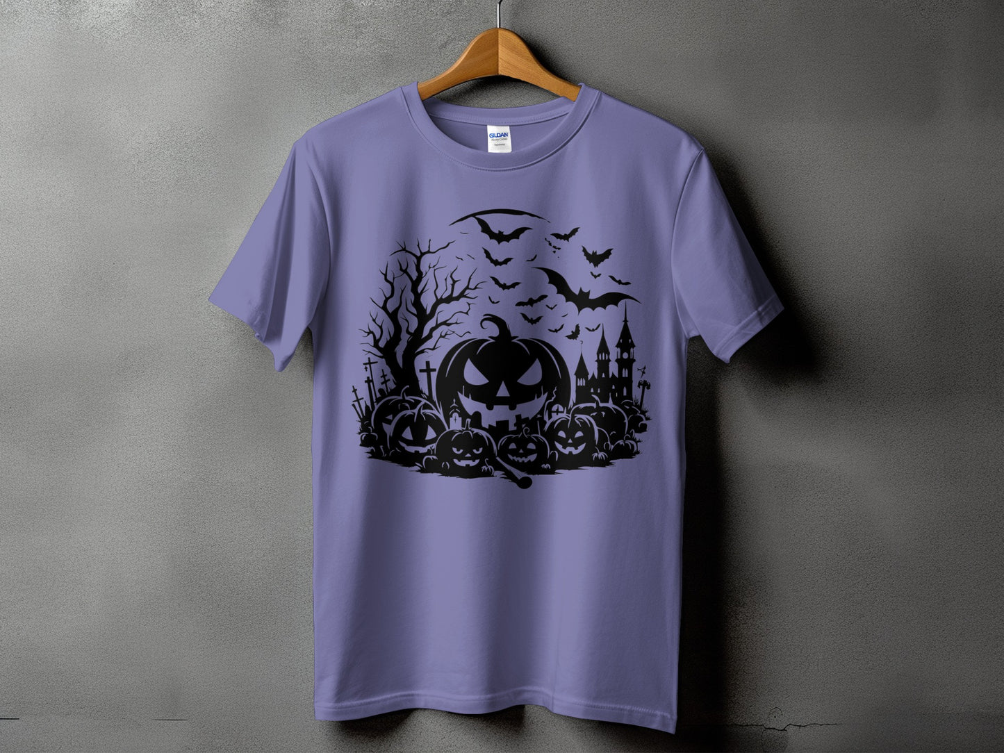 Purple t-shirt with a black Halloween graphic featuring pumpkins, bats, and a spooky castle.