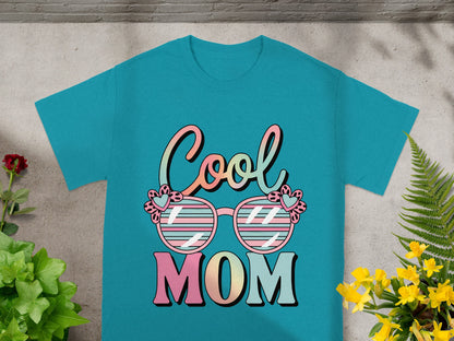 Turquoise t-shirt with "Cool Mom" text and pink-striped sunglasses graphic.