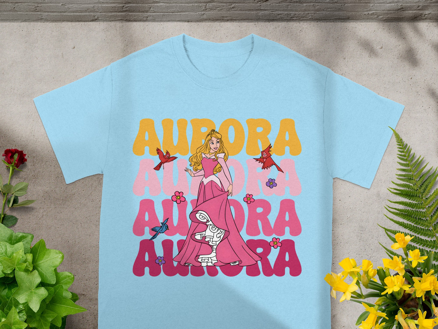 Light blue t-shirt with Disney's Aurora and birds, text reads "AURORA".