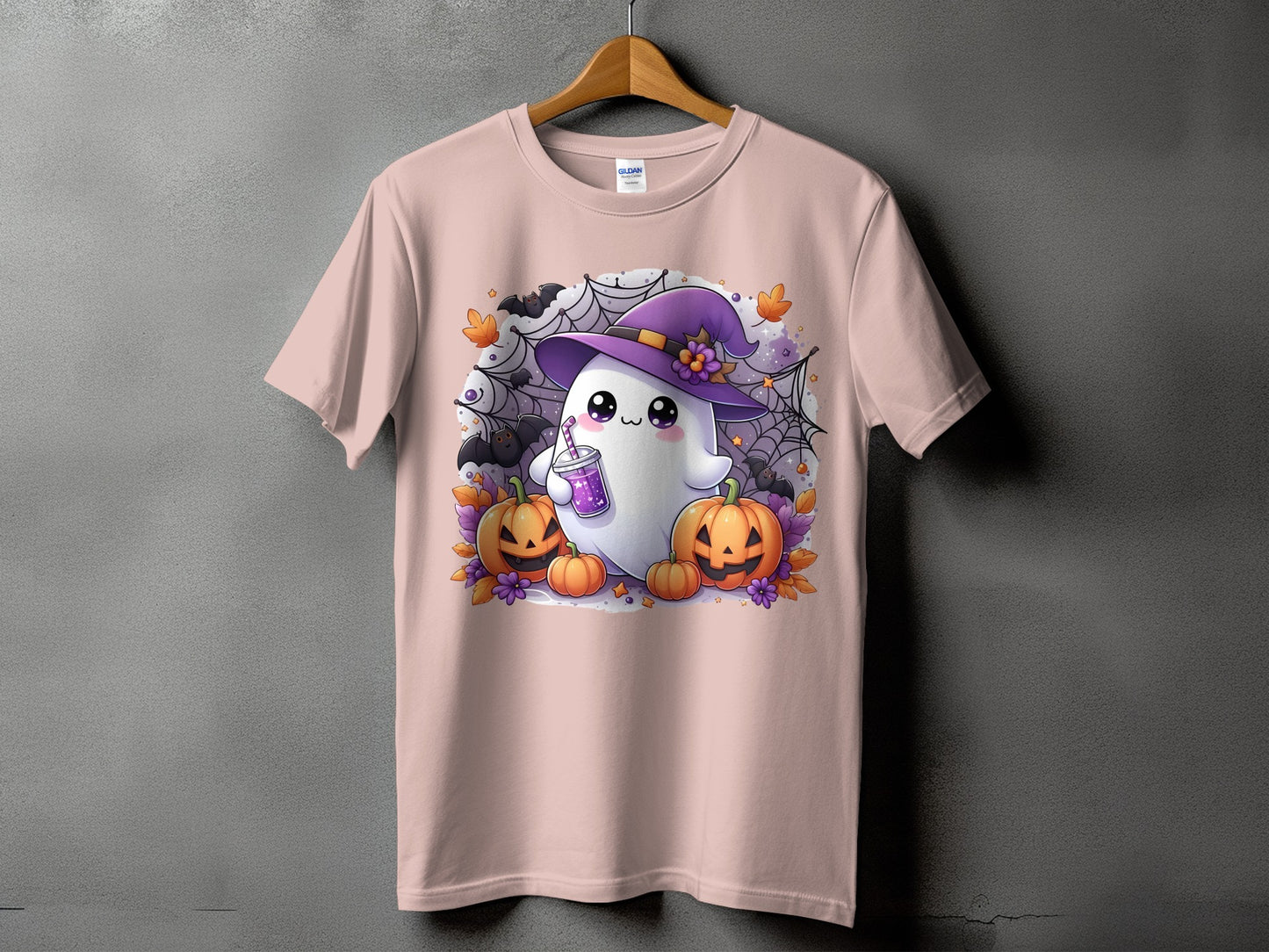 Pink t-shirt with a cute ghost wearing a witch hat and holding a drink.