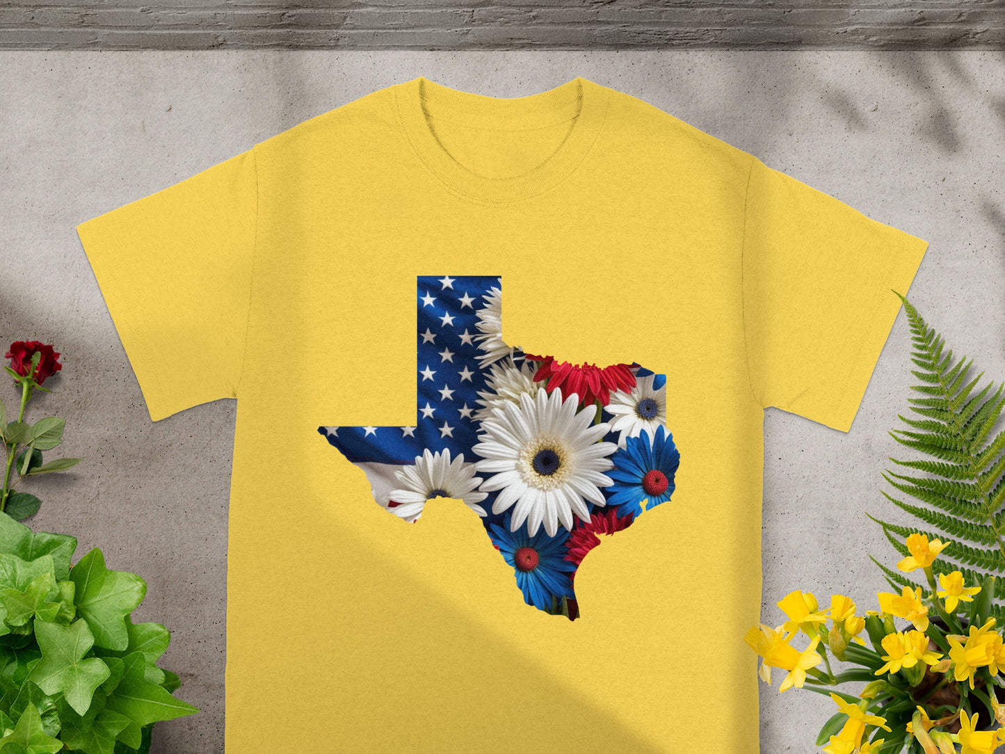 Yellow t-shirt with Texas outline filled with American flag and flowers.