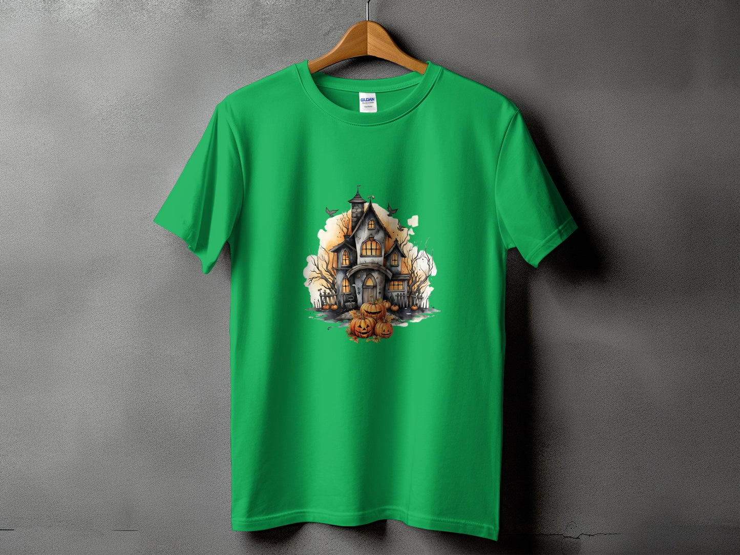 Green t-shirt with a haunted house and pumpkins Halloween graphic print.