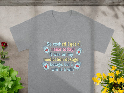 Gray t-shirt with text "So excited I got a raise today! It was on my medication dosage, but a win is a win."