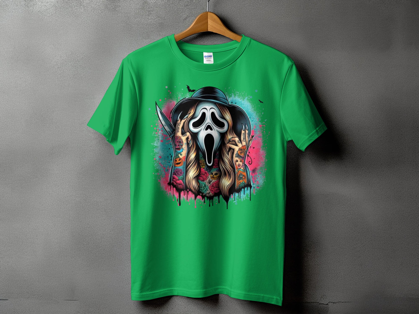Green t-shirt with a graphic of a tattooed character in a Ghostface mask holding a knife.