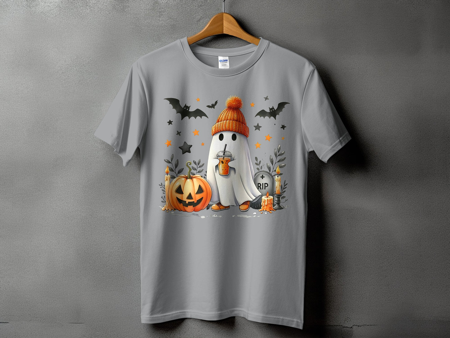 Ghost with pumpkin, bats, candles, and a RIP tombstone on a gray t-shirt.
