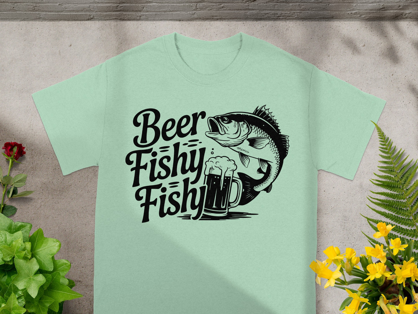 Light green t-shirt with black graphic of a bass fish and beer mug that says "Beer Fishy Fishy".