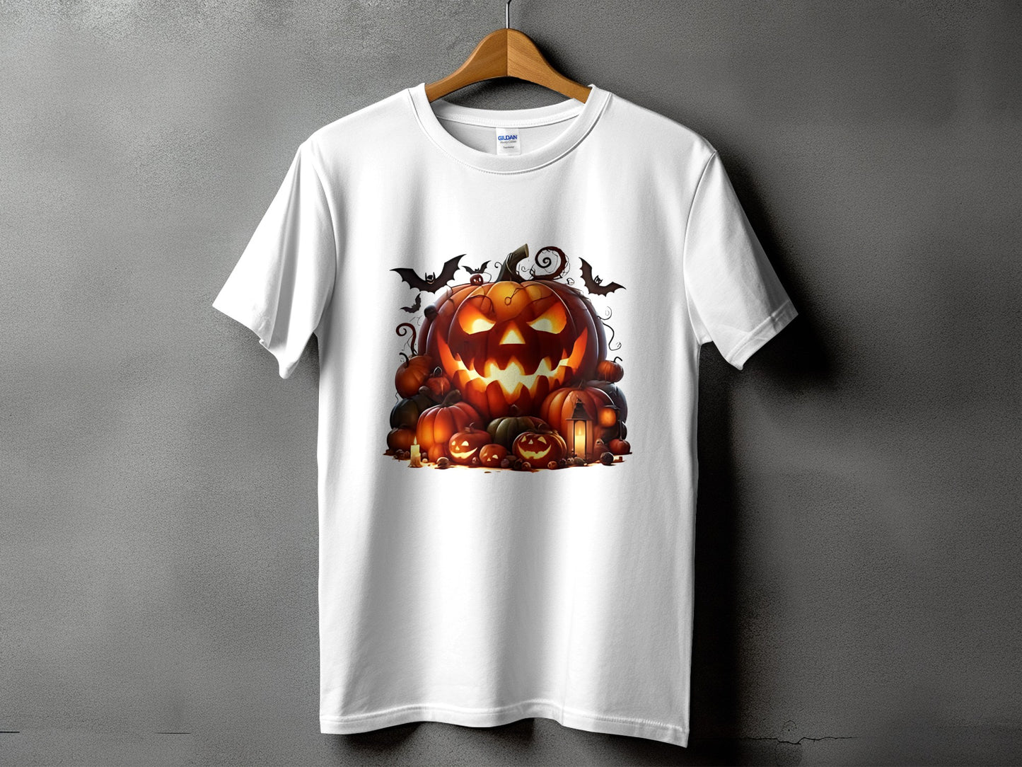 White t-shirt with a Halloween pumpkin pile and bat graphic design.