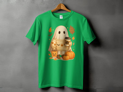 Green t-shirt with a ghost wearing a sweater holding coffee and surrounded by pumpkins.