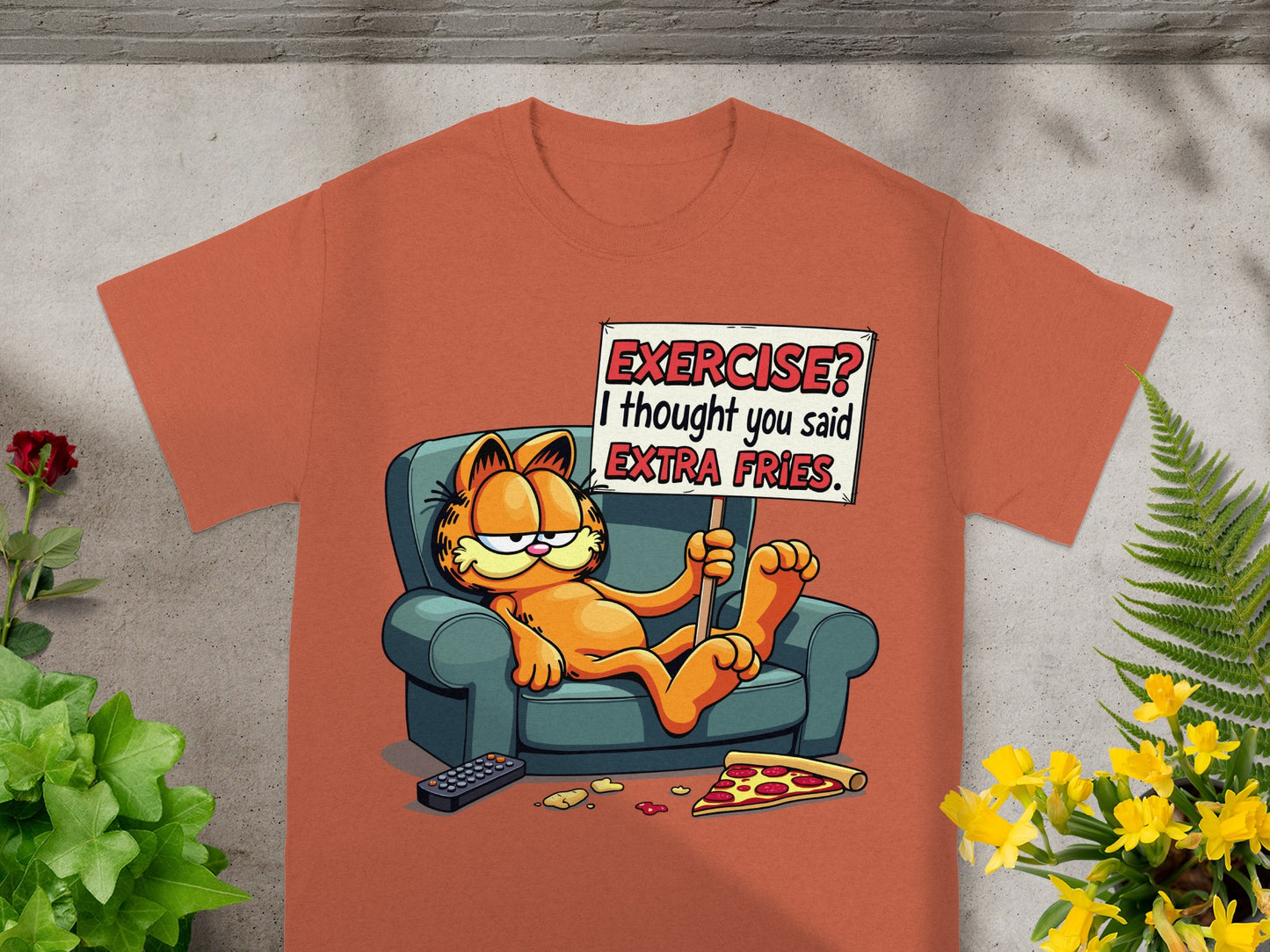 Orange t-shirt with Garfield lounging and holding a sign saying "EXERCISE? I thought you said EXTRA FRIES."