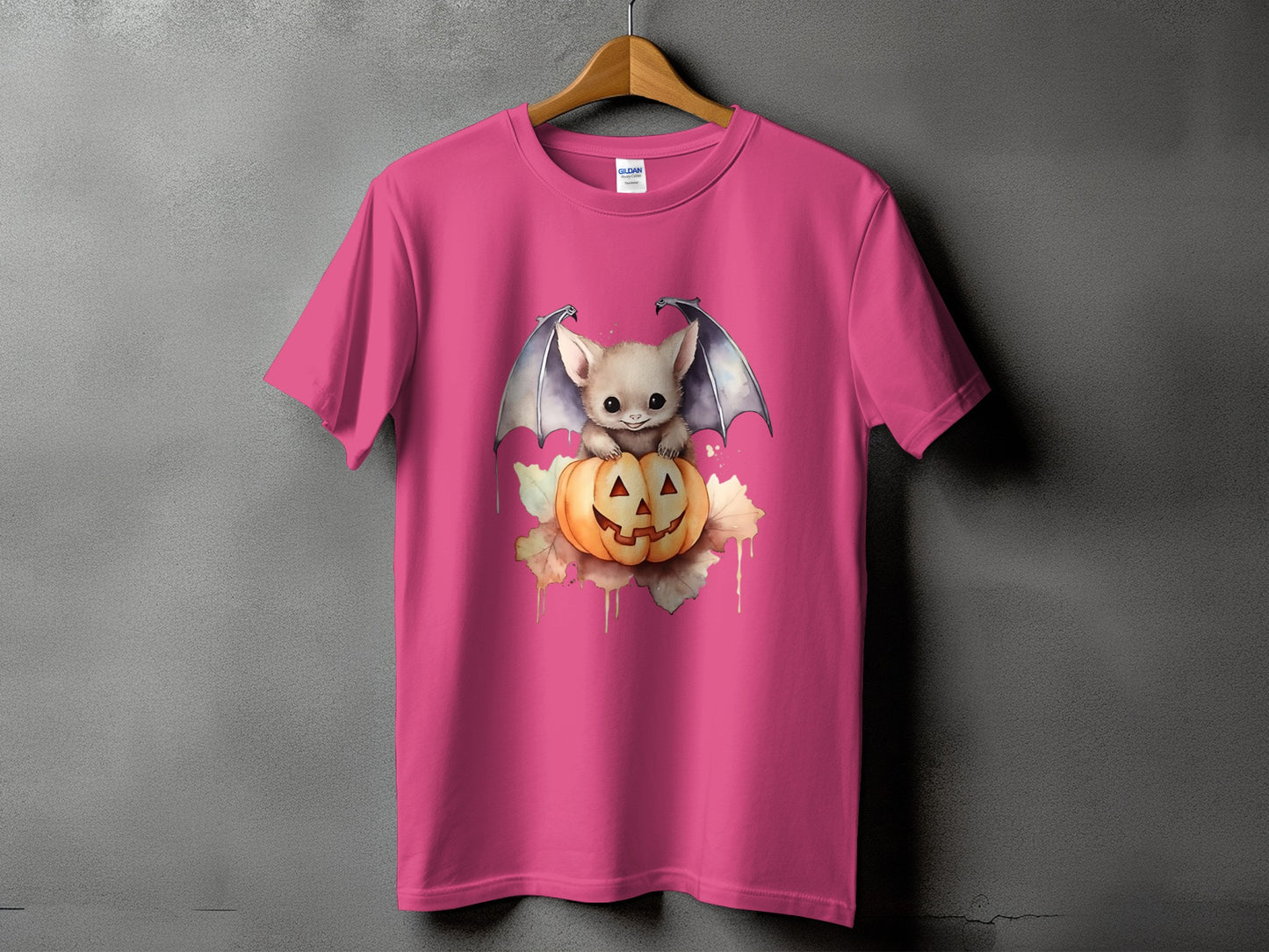 Pink t-shirt with a cute bat on a jack-o-lantern graphic.