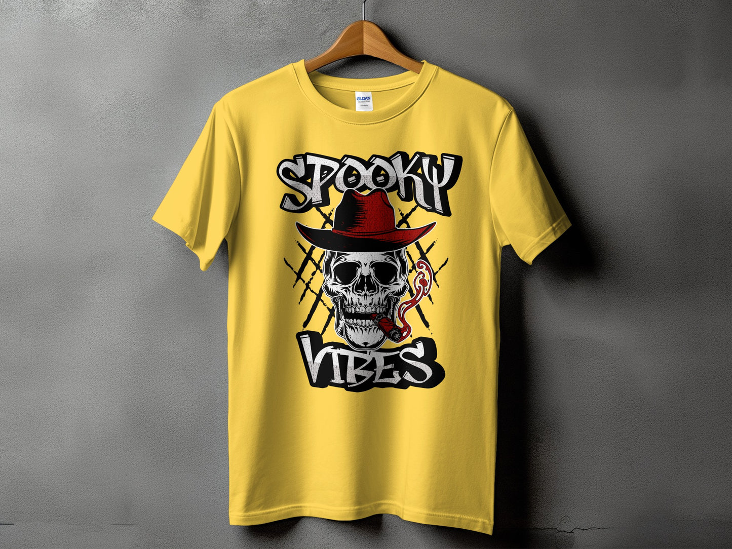Yellow t-shirt with skull, hat, cigar, and text that reads "SPOOKY VIBES".