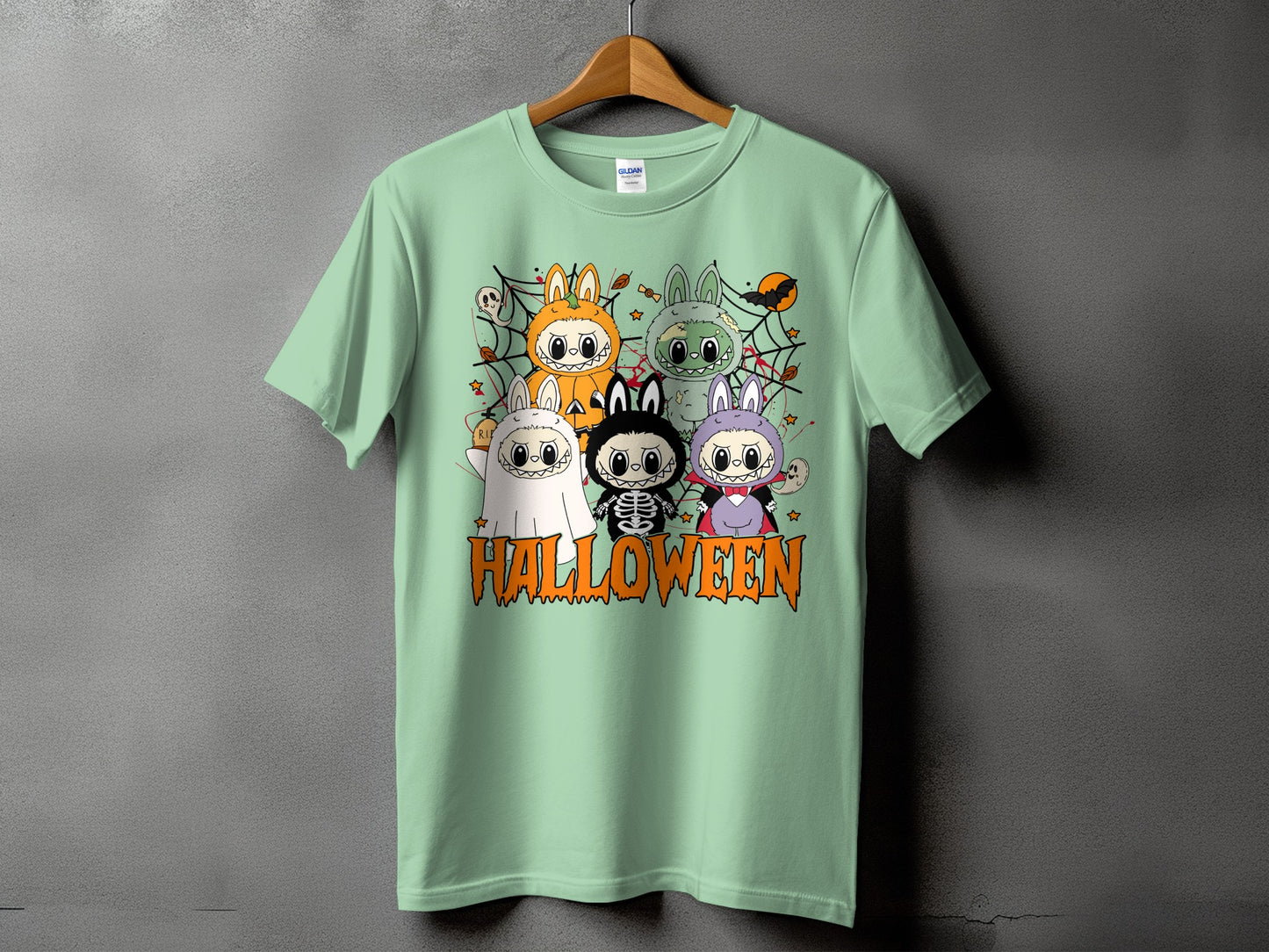 Light green t-shirt with "HALLOWEEN" text and cartoon characters in costumes.