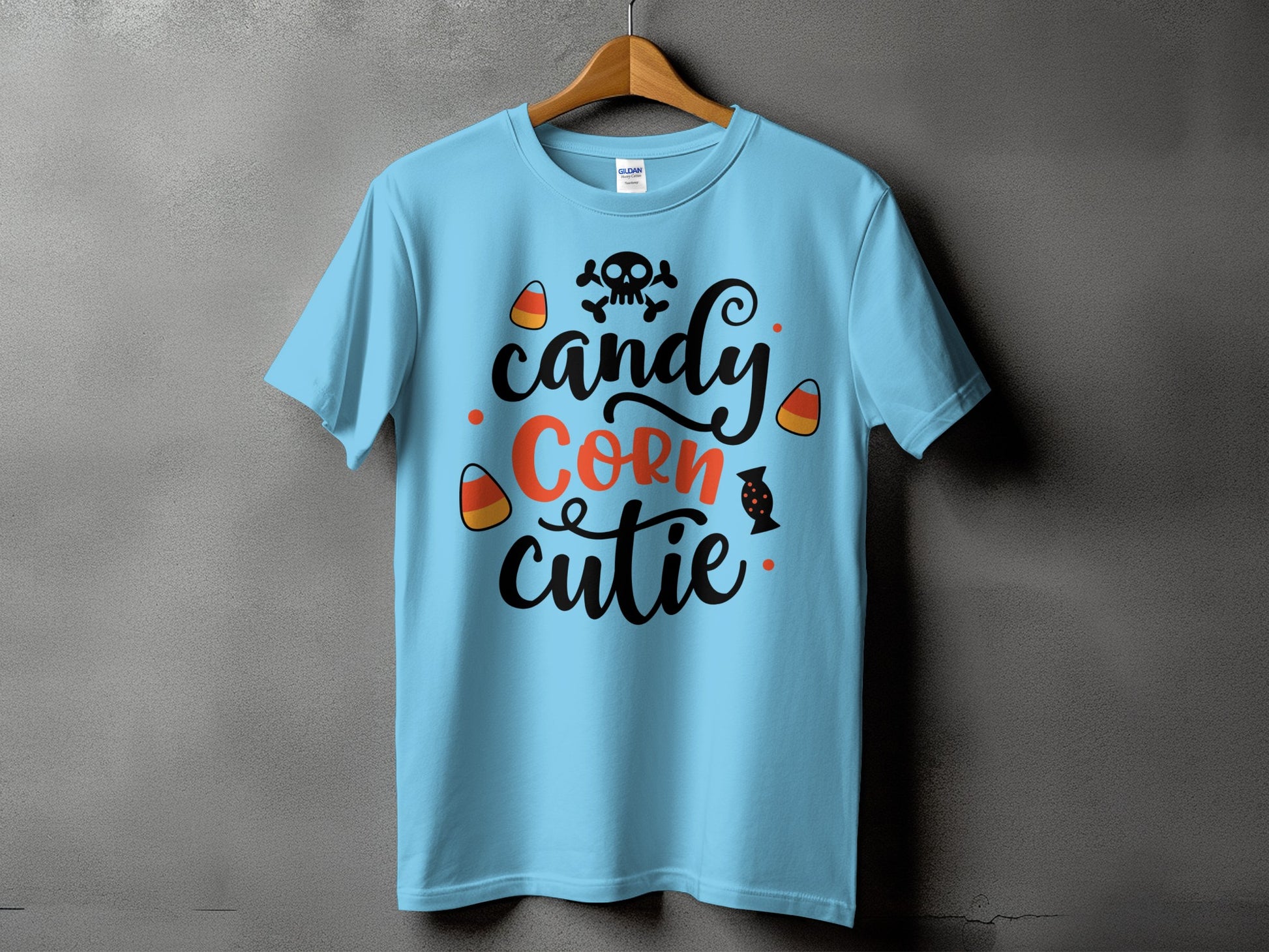 Light blue t-shirt with "Candy Corn Cutie" text and Halloween graphics.