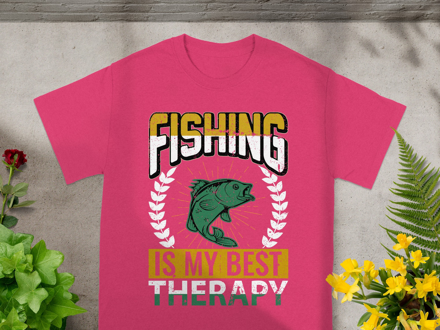 Pink t-shirt with "FISHING IS MY BEST THERAPY" and fish graphic.