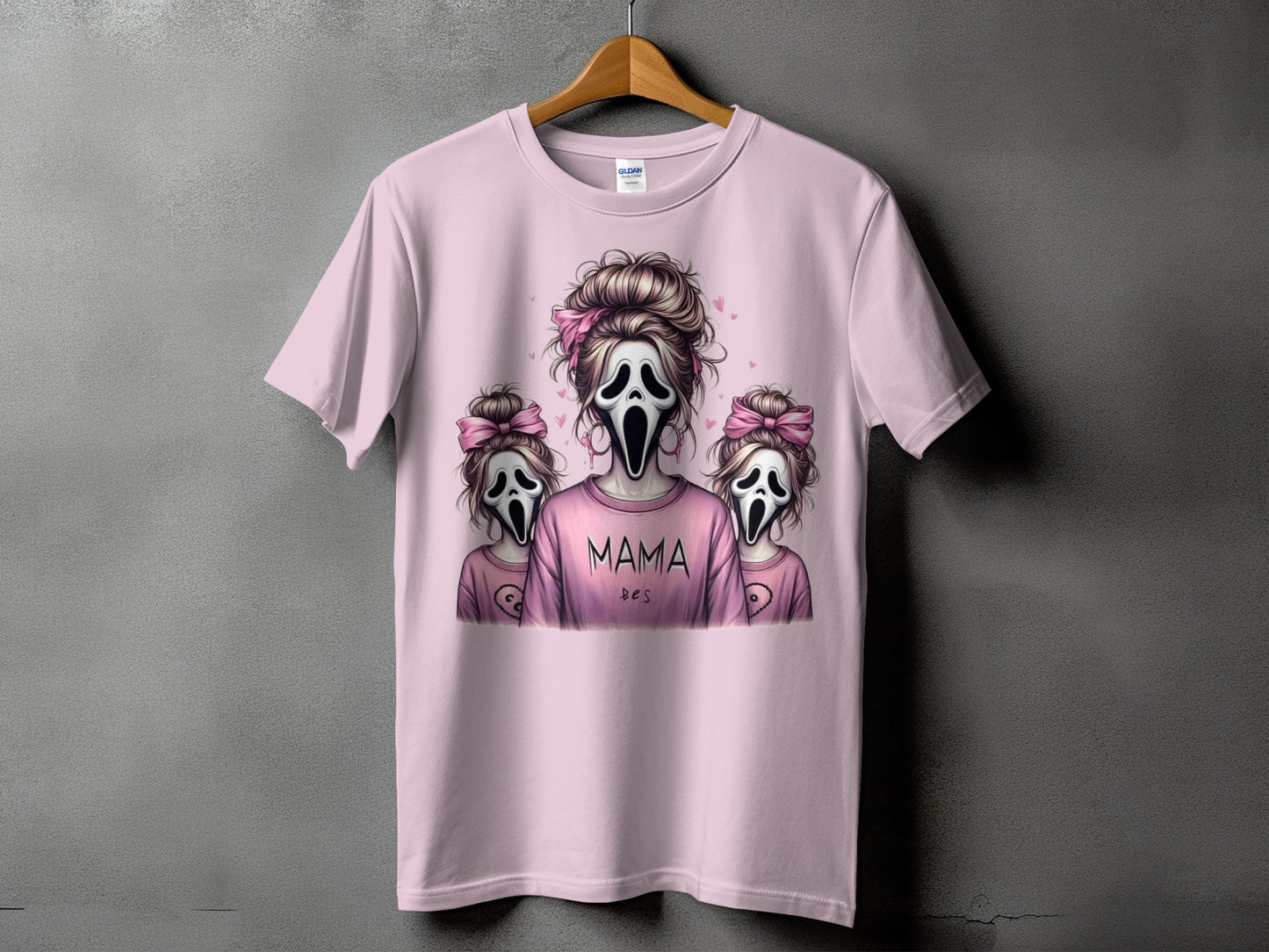 Pink t-shirt with ghost masks and text "MAMA DES"