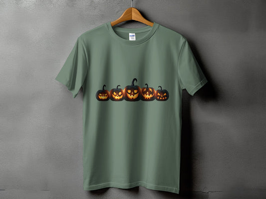 Green t-shirt with a row of five glowing jack-o'-lanterns across the chest.