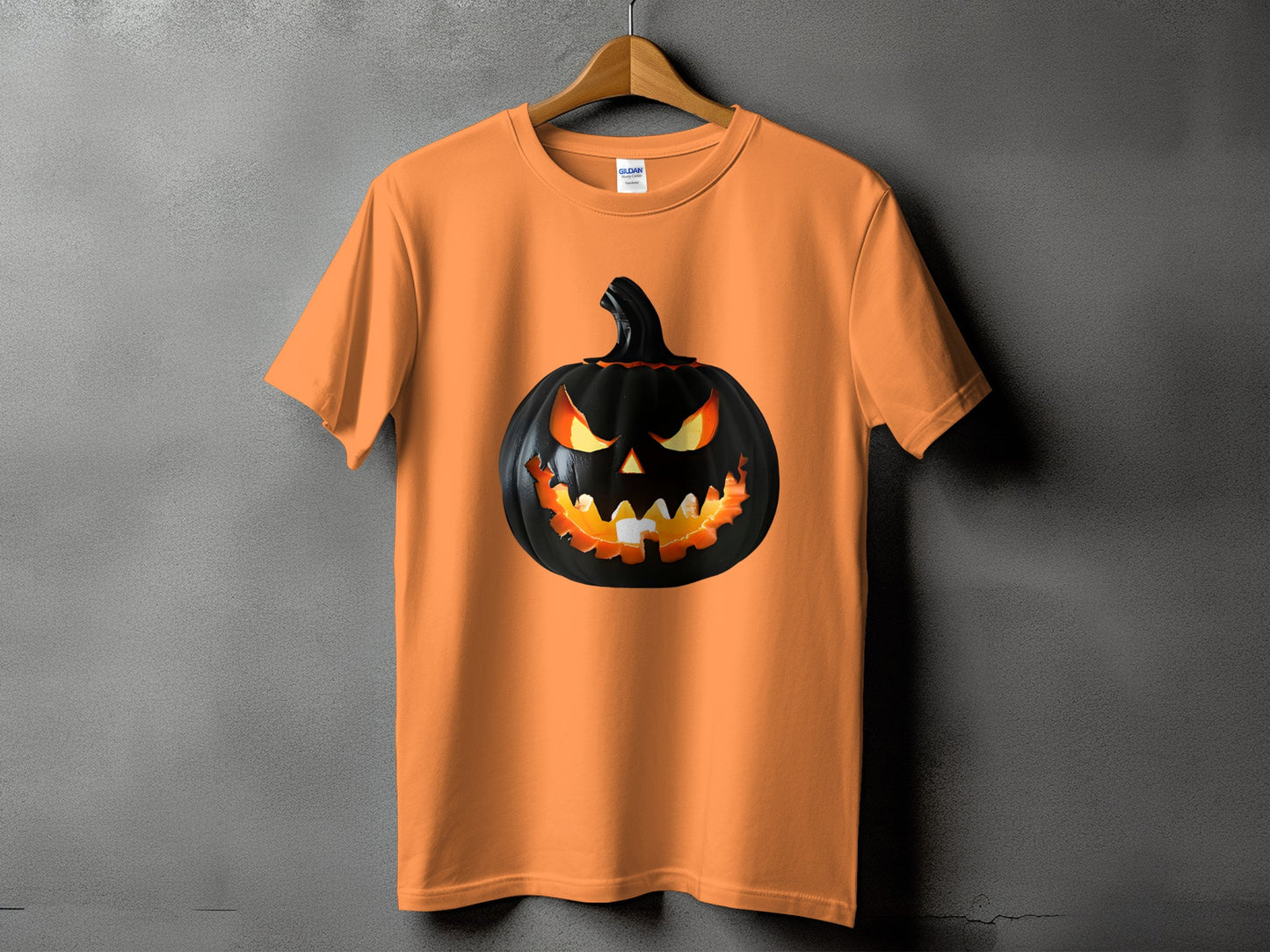 Orange t-shirt with a black, glowing jack-o'-lantern graphic.