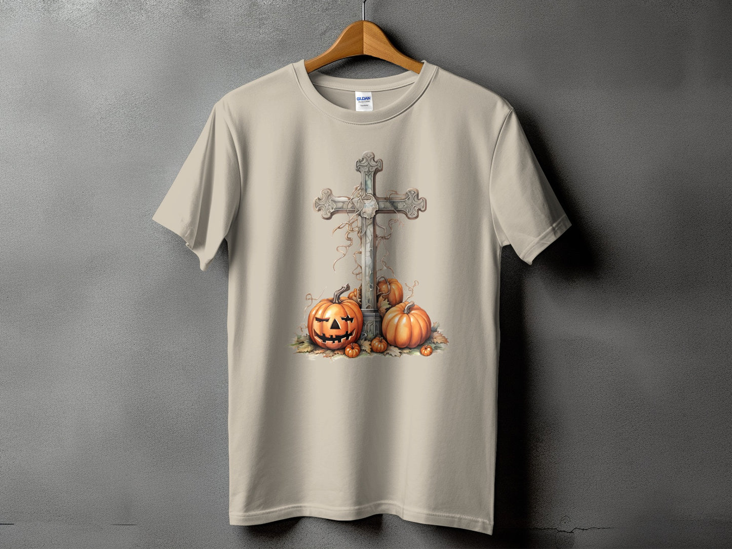 Light tan t-shirt with a Halloween graphic of a cross and pumpkins.