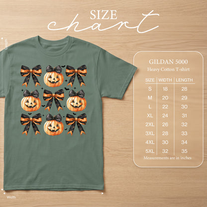 Green t-shirt with a repeating pattern of jack-o'-lanterns and black and orange bows.
