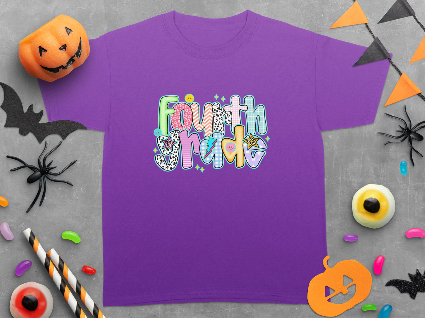 Purple short-sleeve t-shirt with "Fourth Grade" text in colorful, patterned letters.