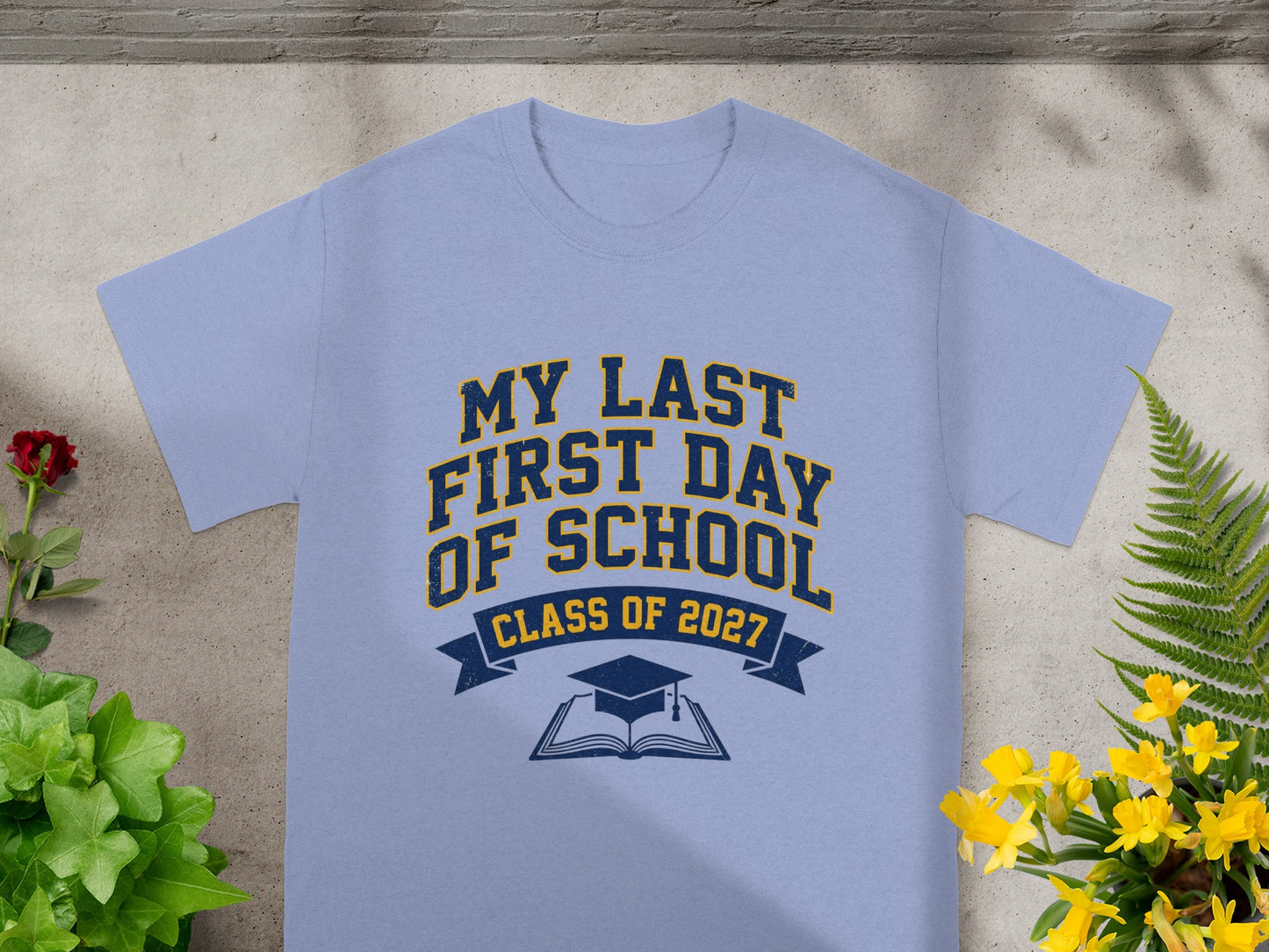 Light blue t-shirt with "My Last First Day of School Class of 2027" text.