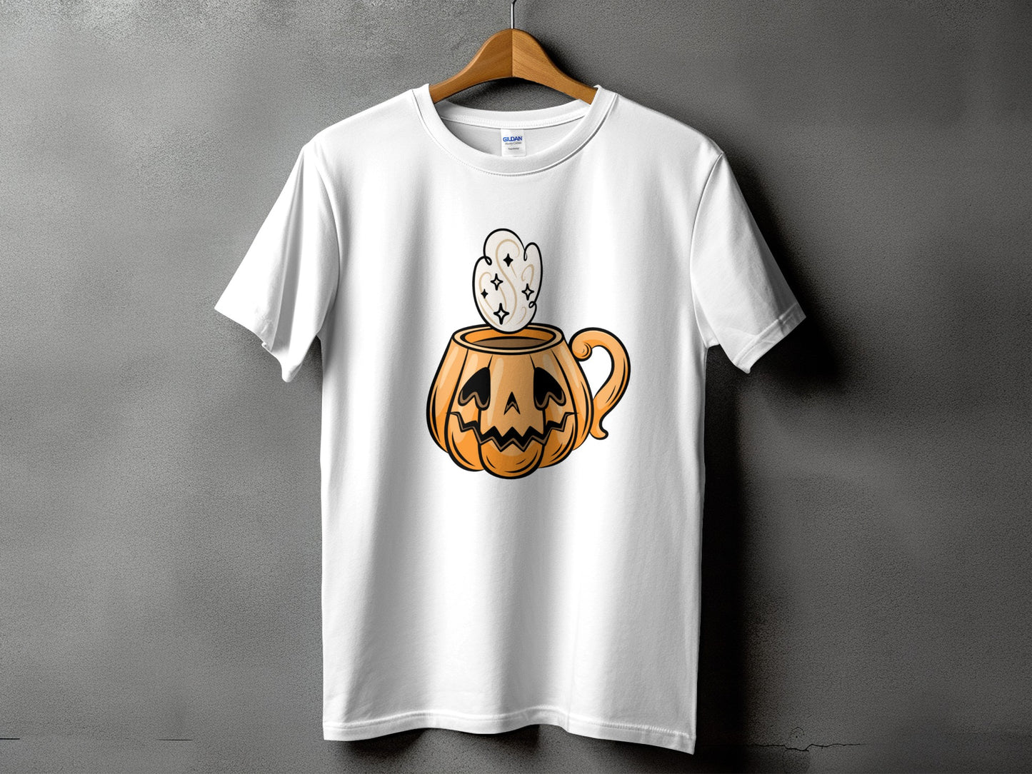 White t-shirt with a cartoon jack-o'-lantern mug filled with frothy steam.
