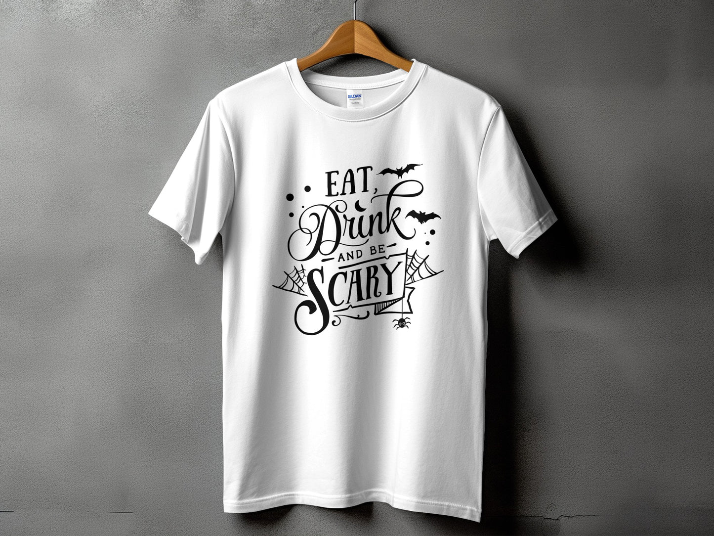 White t-shirt with "Eat, Drink, and be Scary" Halloween graphic and bats.