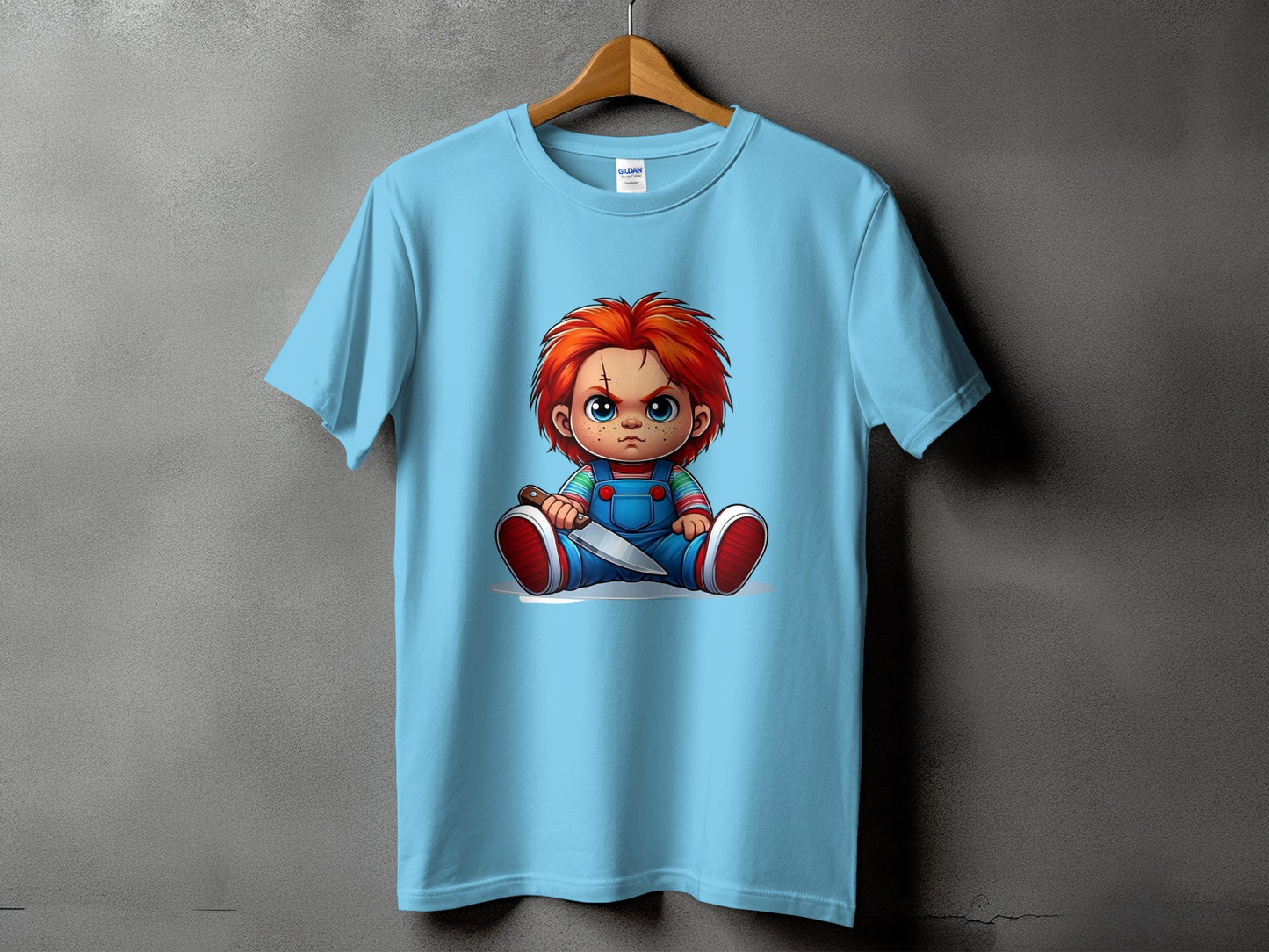 Chucky doll graphic print t-shirt with blue overalls and a knife.