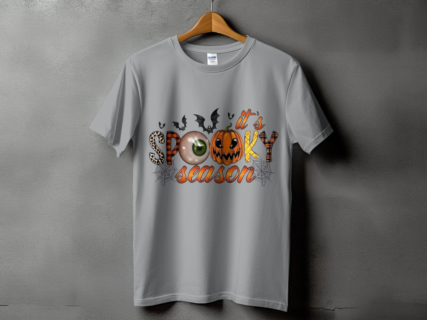 Gray t-shirt with "It's Spooky Season" Halloween graphic featuring a pumpkin, eye, and bats.