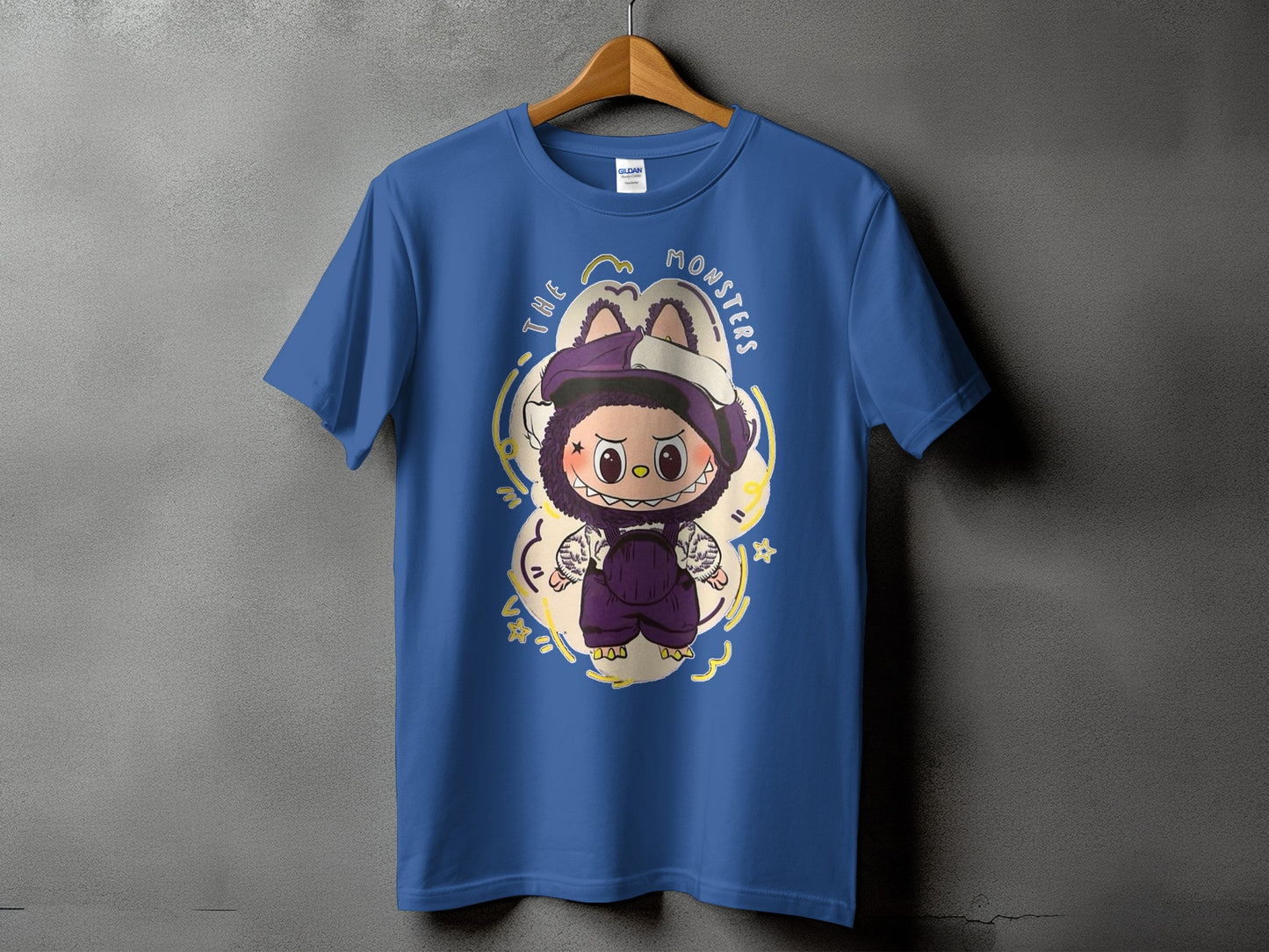 Blue t-shirt with "The Monsters" text and cartoon character graphic.