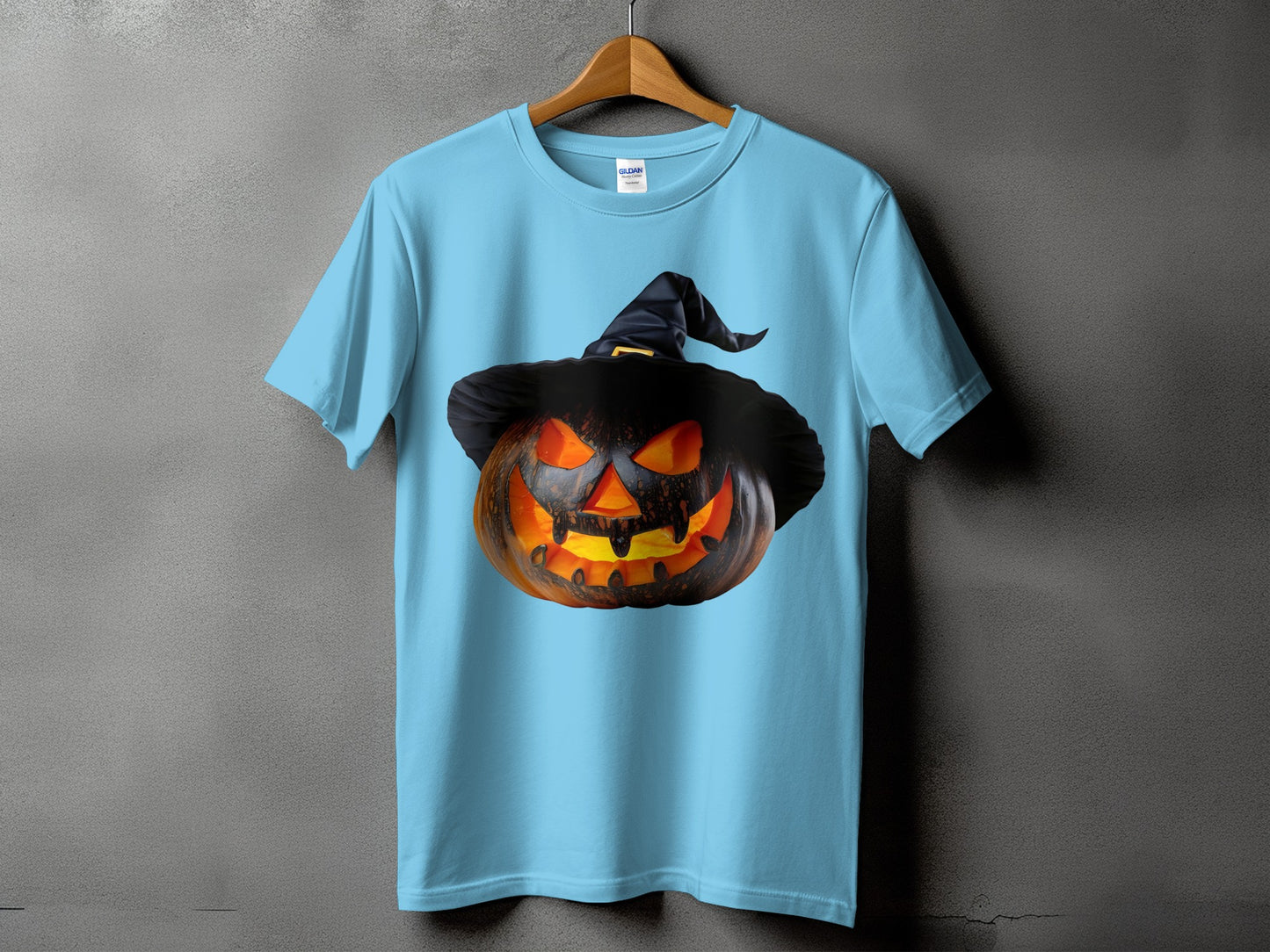 Light blue t-shirt featuring a carved Jack-o'-lantern wearing a witch hat.