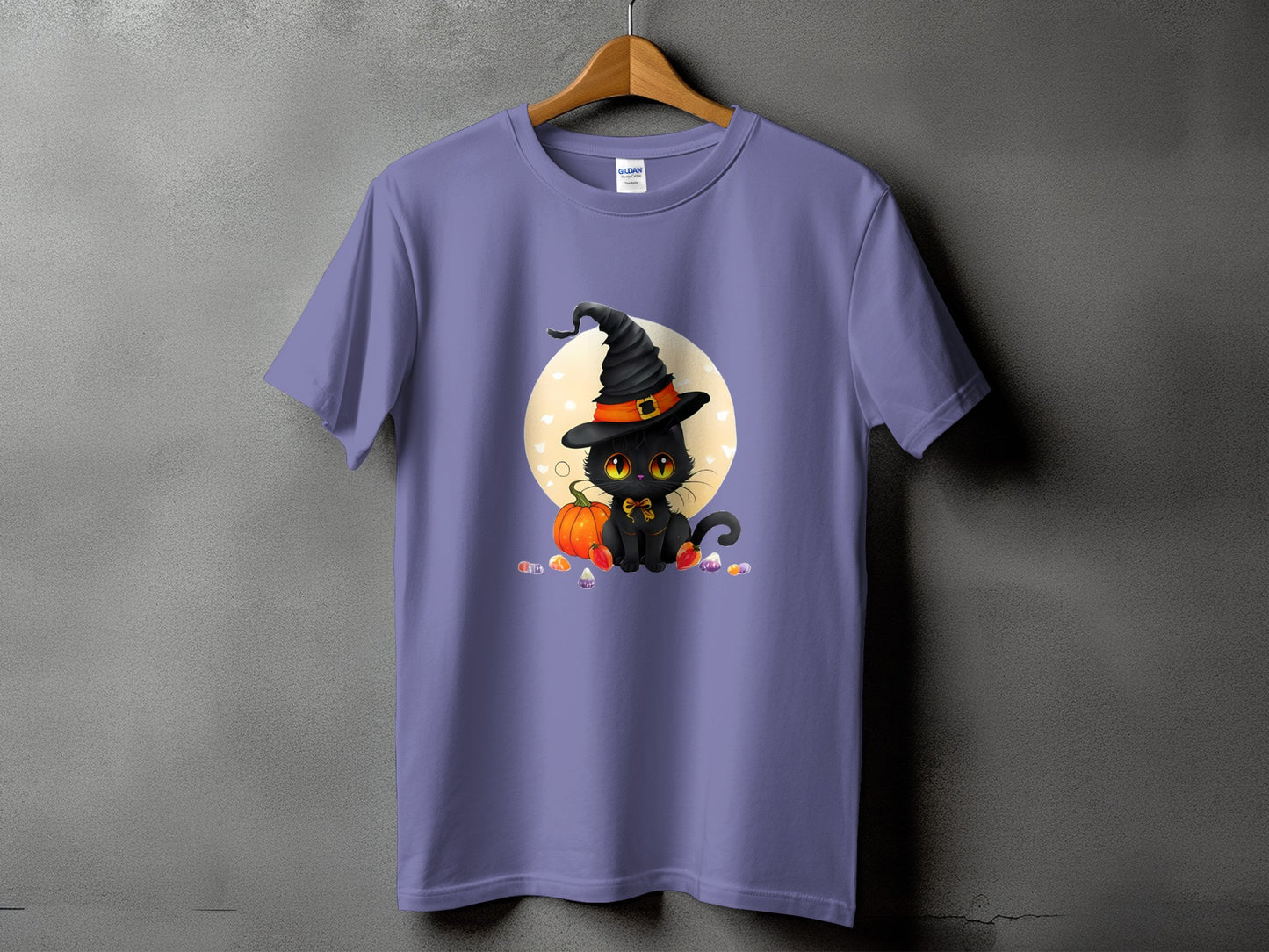 Purple t-shirt with a black cat wearing a witch hat and trick-or-treat candy.