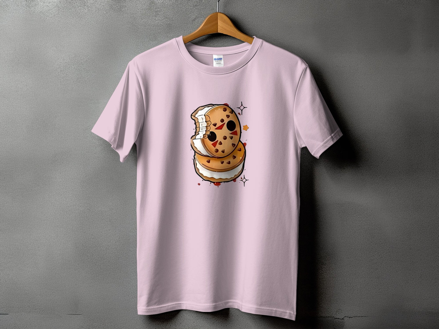 Pink t-shirt with a graphic of a bitten ice cream sandwich.
