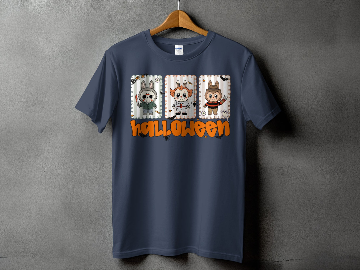 Dark blue t-shirt with three cartoon Halloween characters and the word "halloween".