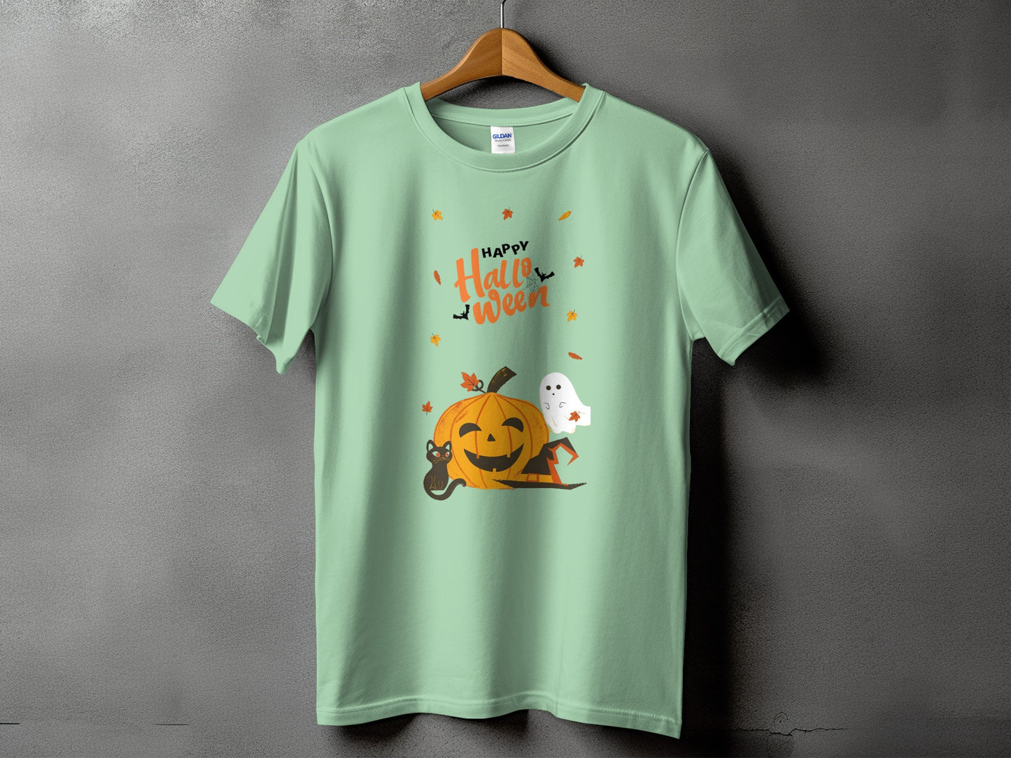 Mint green t-shirt with "Happy Halloween" text, jack-o'-lantern, black cat, and ghost.