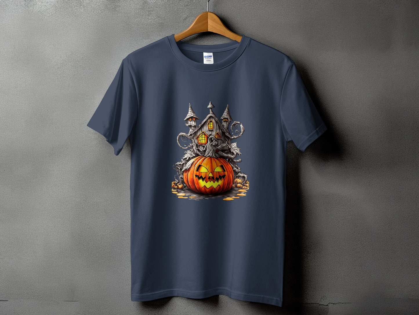 Dark blue t-shirt with a Halloween design featuring a jack-o-lantern and haunted house.