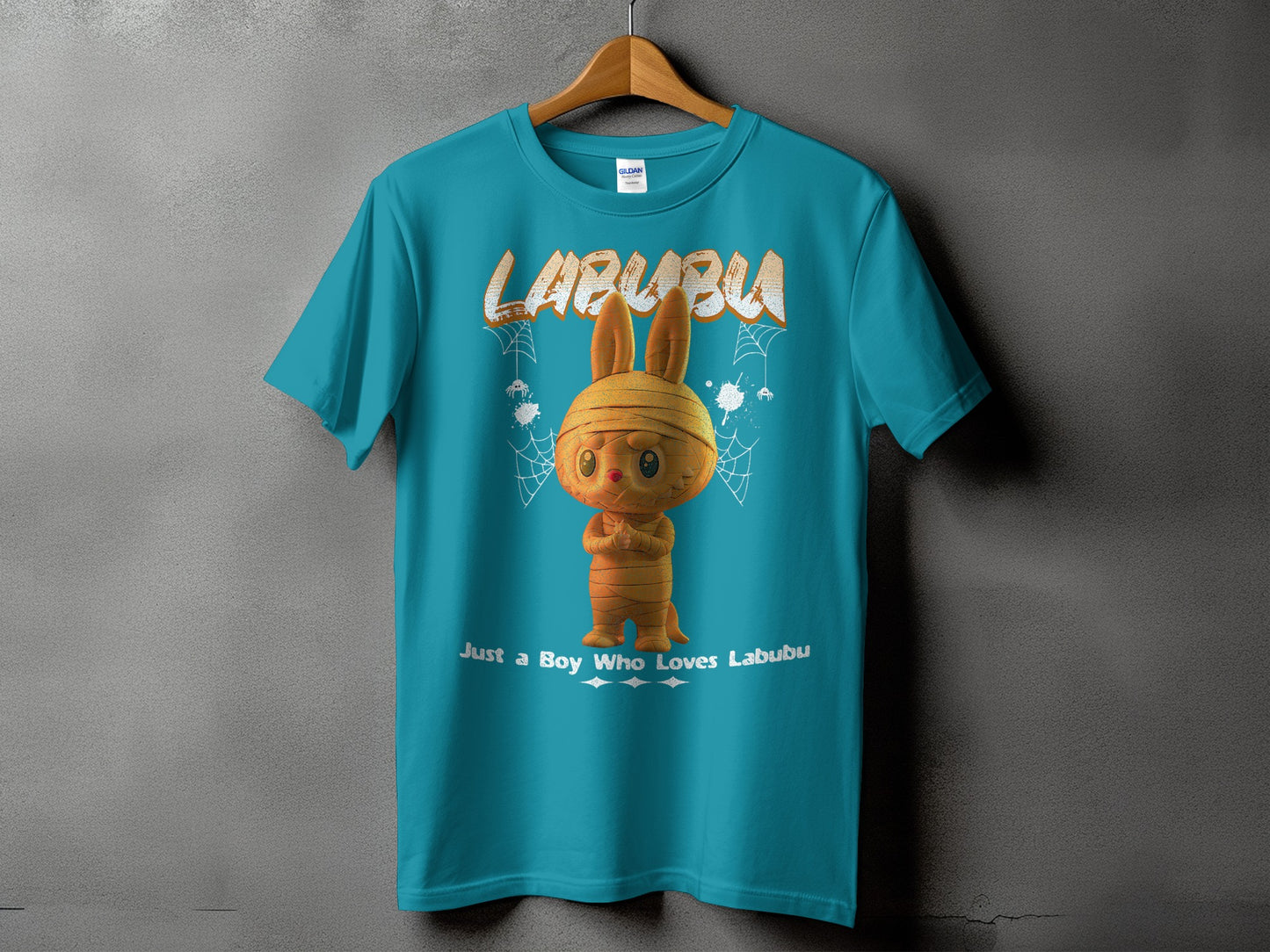 Teal t-shirt with "LABUBU" text and a mummy-like rabbit graphic.