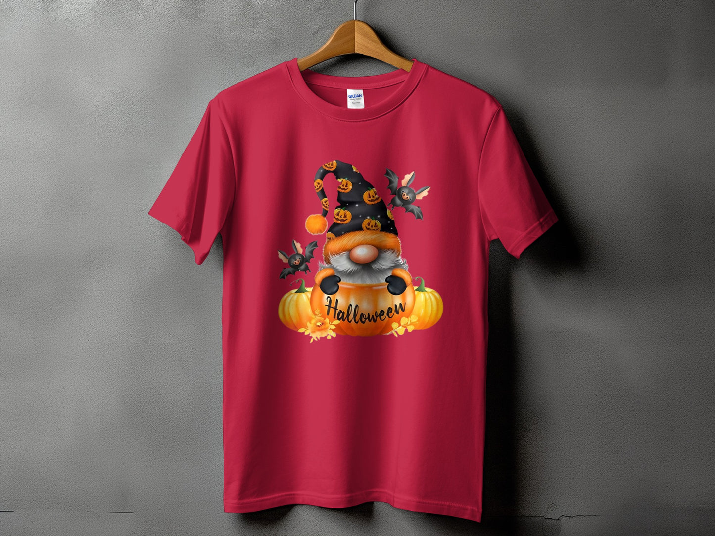 Red t-shirt with Halloween gnome graphic, pumpkins, bats, and text.