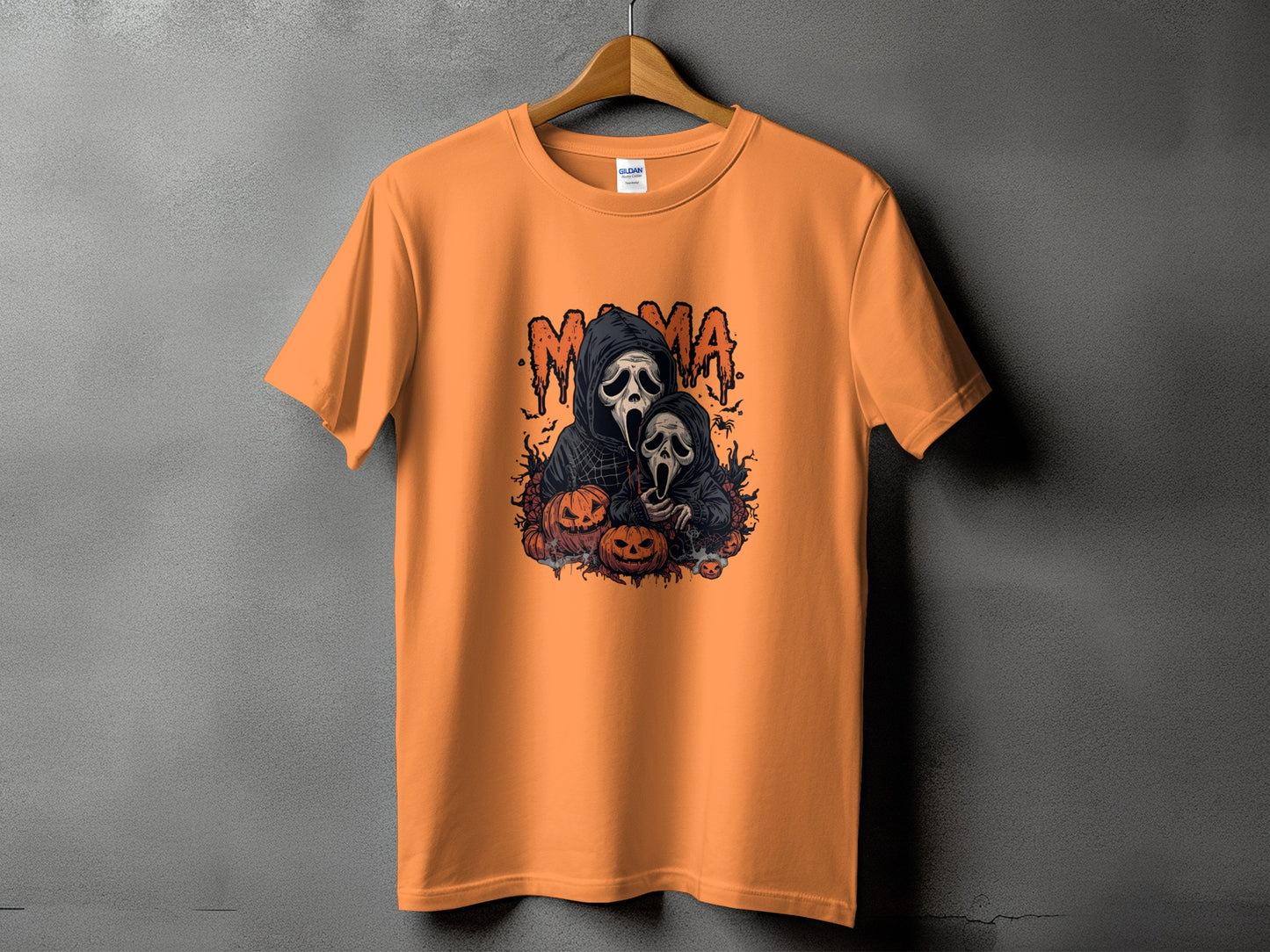 Orange t-shirt with "Mama" in dripping letters and two ghost figures with pumpkins.