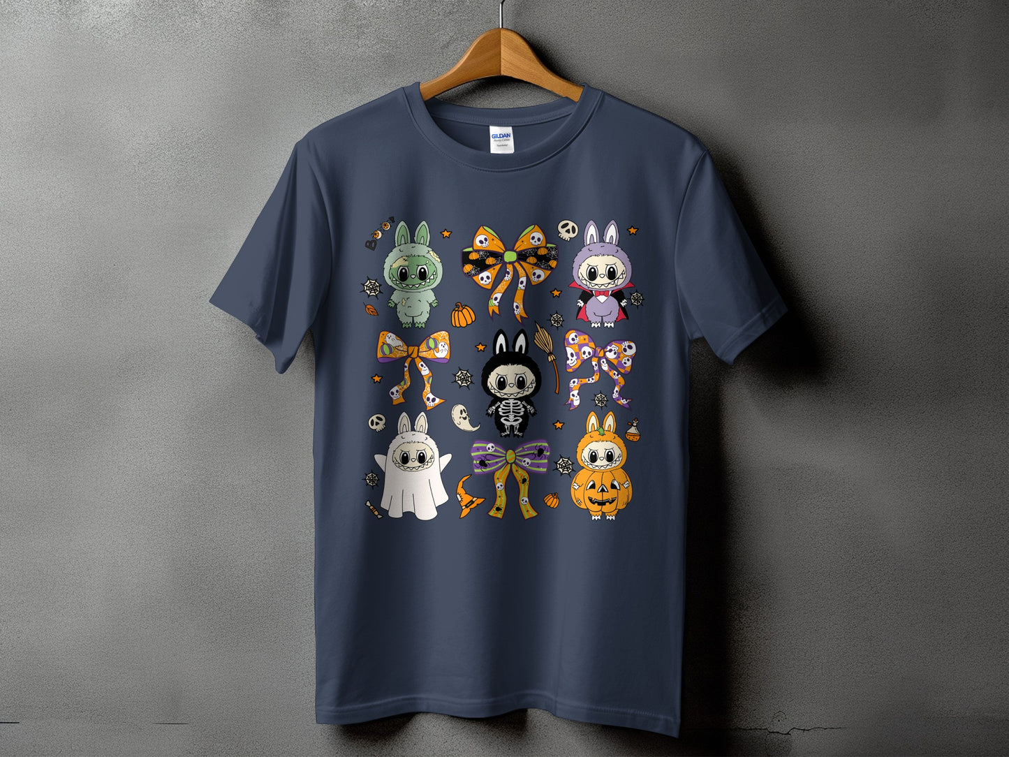 Dark blue t-shirt with cartoon Halloween characters and bows.