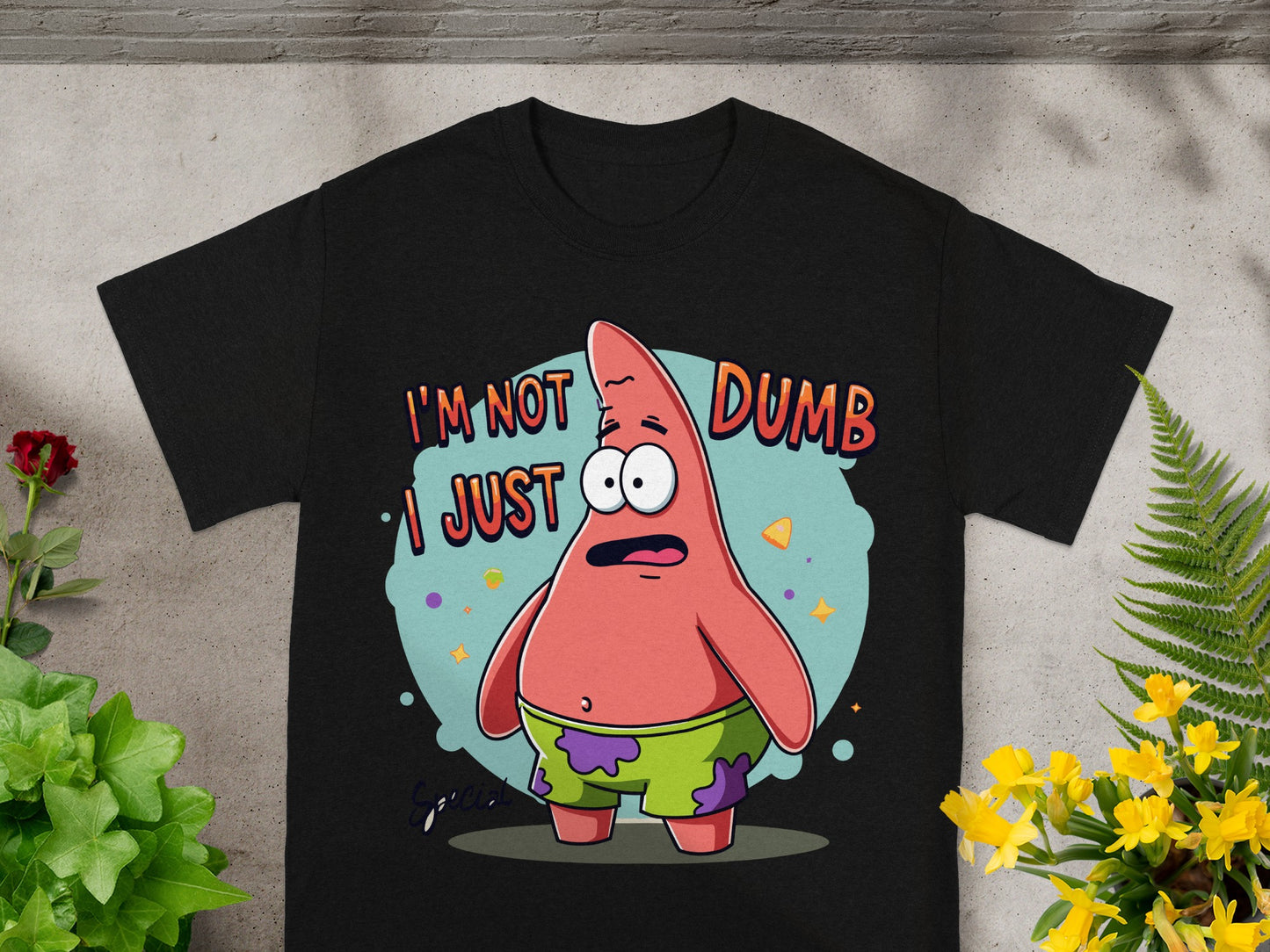 Black t-shirt with Patrick Star from SpongeBob saying "I'm not dumb, I just..."