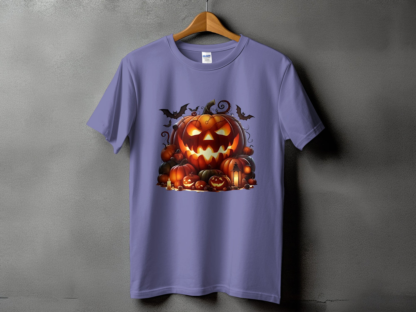 Purple t-shirt with a Halloween jack-o'-lantern and pumpkin pile graphic.